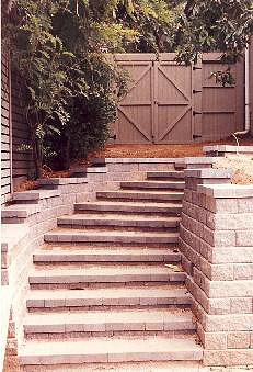 custom stone patio stairs and gate built